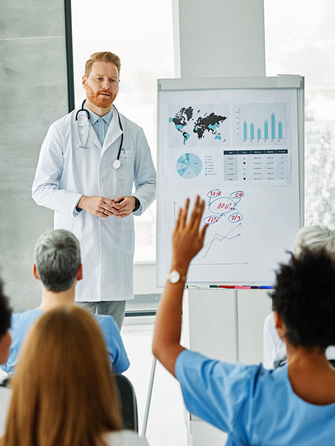 seminar business meeting doctor conference audience presentation education lecture hospital man event training speaker group convention congress speech student Incentive Payment Multiplier What It is